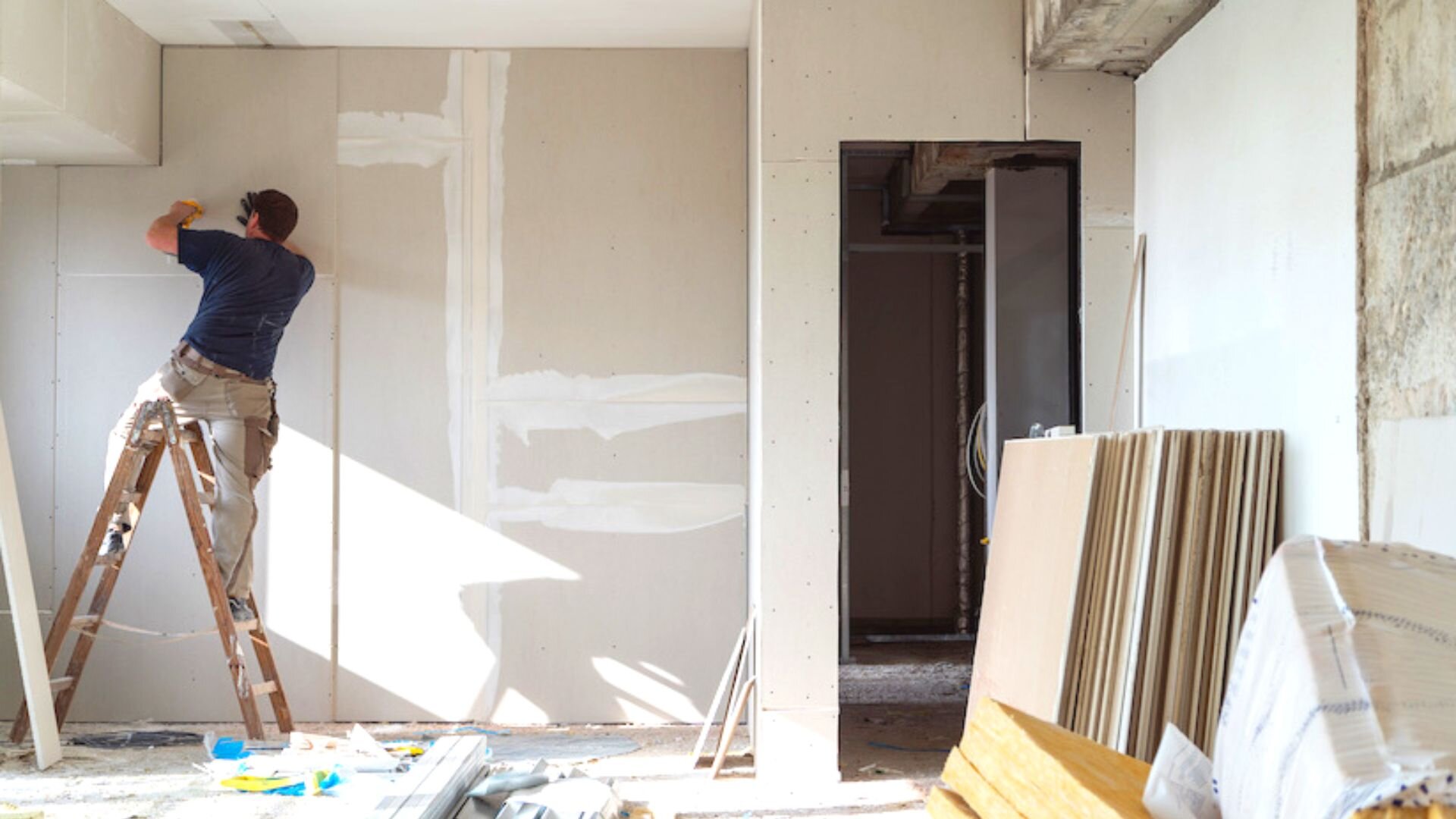 Man On Ladder Putting Up Walls Man Ladder Putting Walls